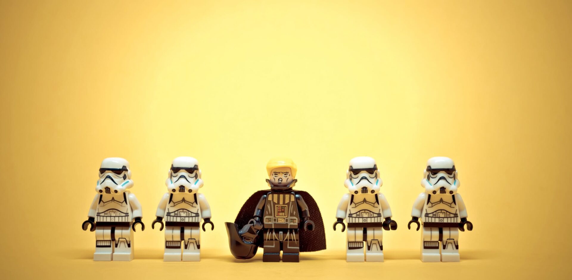Four stormtroopers are standing in a line with Darth Trump leading them on a yellow background. Illustrative editorial. January 20, 2025. By kirill_makarov - AdobeStock